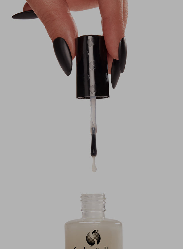 Hand holding the Seche Nail Lacquer opened 